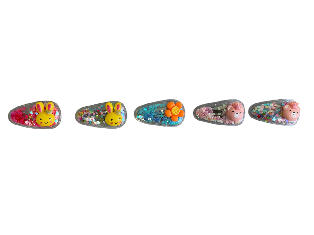 990082 - Pack 5 Clip Transparente relleno de purpurina con motivos infantiles